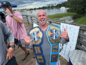 Thomas Herman with two belts from Red Bull Double Up