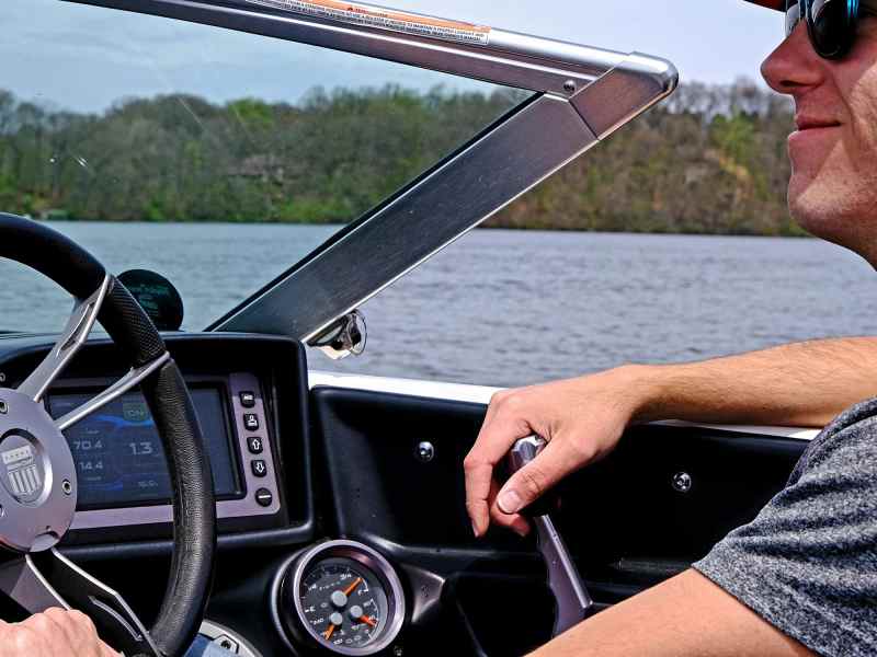 WKB0622-Driver-Mistakes-driveratwheel Driver at helm of watersports boat