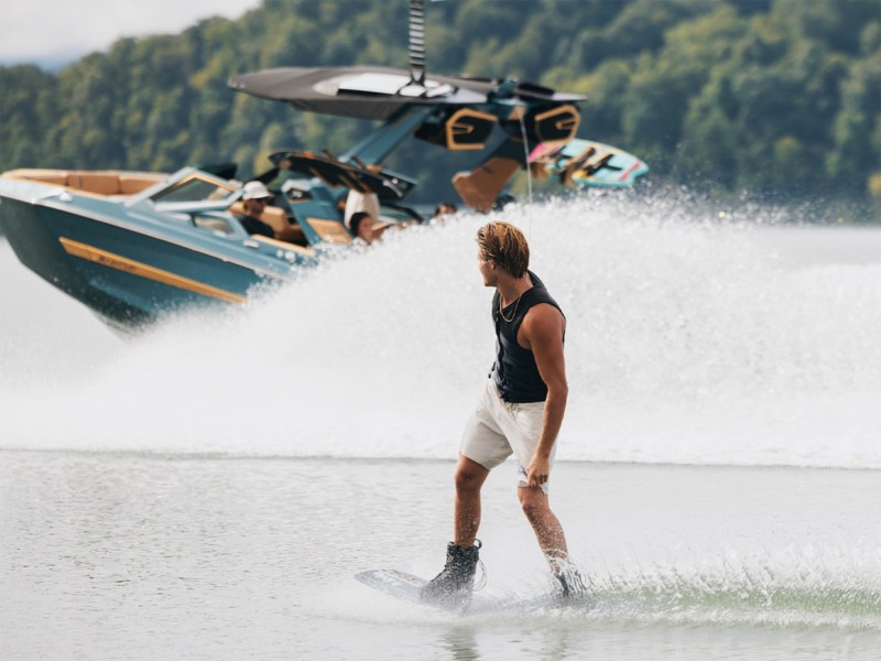MasterCradtriderExp Wakeboarder wit Mastercraft boat in background